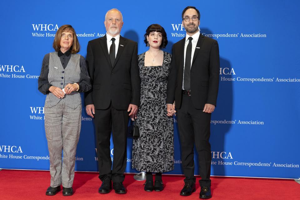 FILE - From left; Ella Milman and Mikhail Gershkovich, parents of Wall Street Journal reporter Evan Gershkovich, and Danielle Gershkovich and Anthony Huczek, the journalist’s sister and brother-in-law, pose for photographers as they arrive at the annual White House Correspondents' Association Dinner in Washington, Saturday, April 29, 2023. (AP Photo/Jose Luis Magana, File)