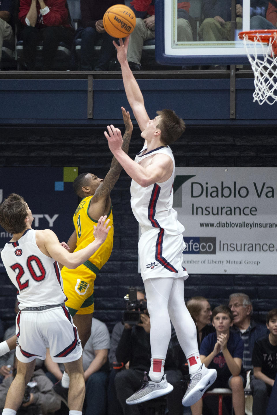 Saint Mary's center Mitchell Saxen (11) blocks a shot by San Francisco guard Khalil Shabazz (0) during the second half of an NCAA college basketball game, Thursday, Feb. 2, 2023, in Moraga, Calif. (AP Photo/D. Ross Cameron)