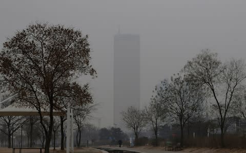 Han river at a park in a smog-covered Seoul, South Korea - Credit: &nbsp;Lee Jin-man/AP