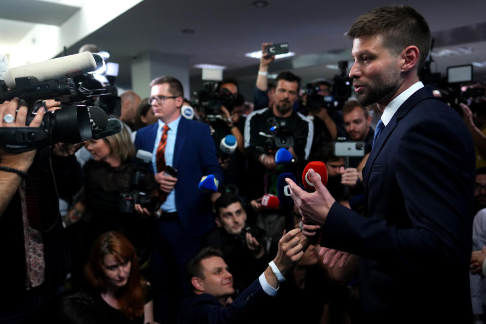 Leader of the Progressive Slovakia party Michal Simecka addresses the media after acknowledging the exit polls during an early parliamentary election in Bratislava, Slovakia, Saturday, Sept. 30, 2023. (AP Photo/Petr David Josek)