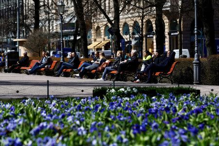 People enjoy a sunnny day at the Esplanade in Helsinki, Finland, May 3, 2017. REUTERS/Ints Kalnins