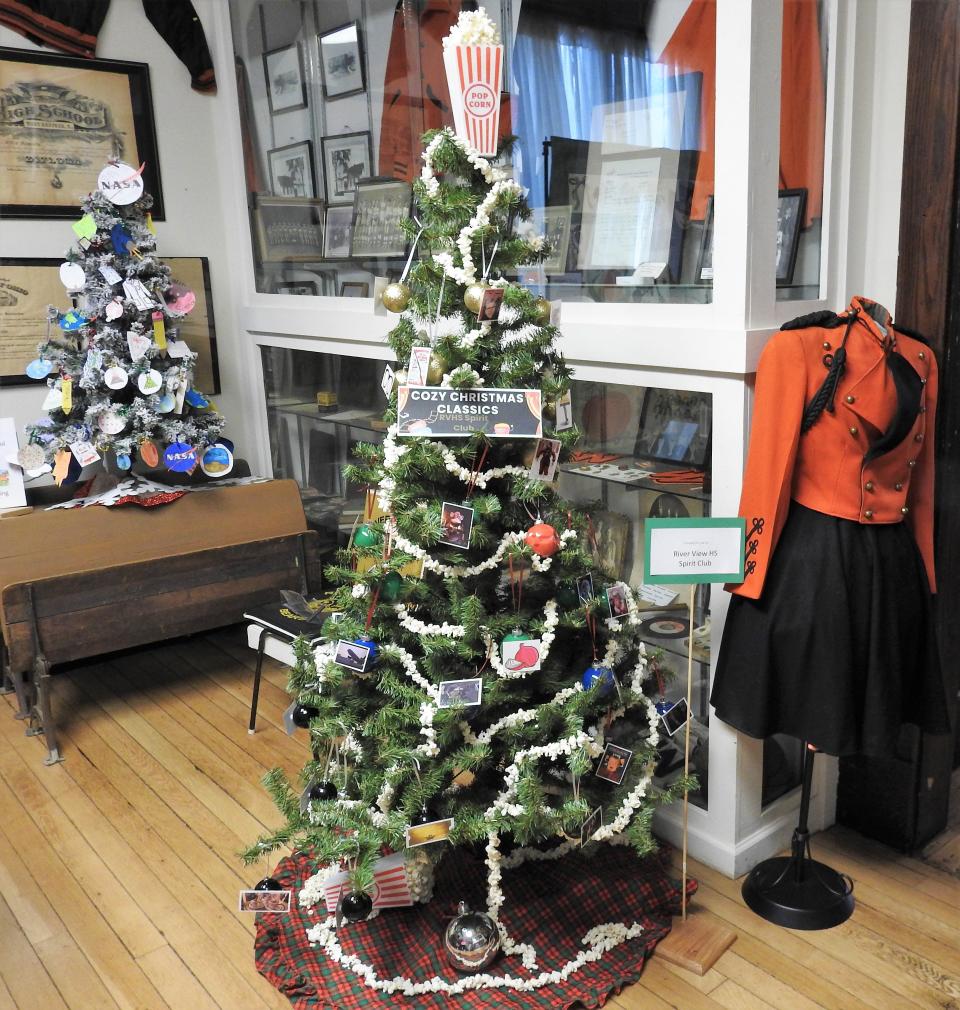 Christmas trees donated by the sixth grade at Warsaw Elementary School and the Spirit Club at River View High School are part of the Festival of Trees at the Walhonding Valley Historical Society Museum in Warsaw.