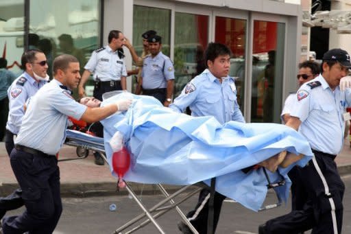 One of the survivors recieves medical care outside Doha's Villaggio Mall after a fire broke out inside the upscale shopping centre, killing at least 19 people, including 13 children