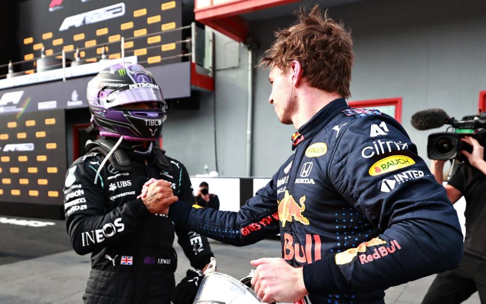 Race winner Max Verstappen of Netherlands and Red Bull Racing and second placed Lewis Hamilton of Great Britain and Mercedes GP shake hands in parc ferme during the F1 Grand Prix of Emilia Romagna at Autodromo Enzo e Dino Ferrari on April 18, 2021 in Imola, Ital - Getty Images Europe /Mark Thompson 