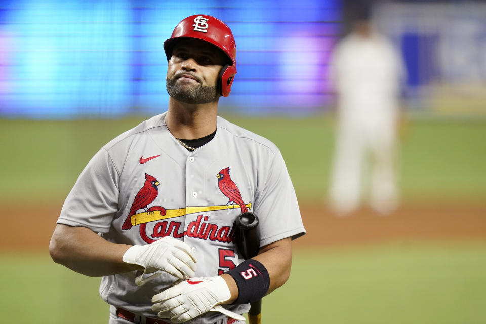 St. Louis Cardinals' Albert Pujols walks to the dugout after striking out during the fourth inning of a baseball game against the Miami Marlins, Thursday, April 21, 2022, in Miami. (AP Photo/Lynne Sladky)