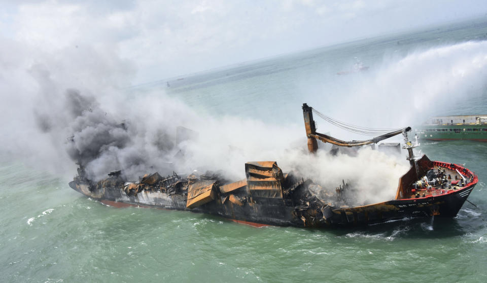 This photo provided by Sri Lankan Air Force shows the sinking MV X-Press Pearl at Kapungoda where it is anchored off Colombo port, Sri Lanka, Wednesday, June 2, 2021. Salvage experts were attempting to tow the fire-stricken container ship that had been loaded with chemicals into the deep sea as the vessel started to sink Wednesday. Water submerged the MV X-Press Pearl's quarterdeck a day after firefighters extinguished a blaze that had been burning for 12 days. (Sri Lanka Air Force via AP)