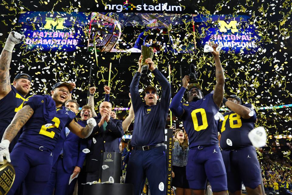 Michigan coach Jim Harbaugh and his team celebrate after winning 2024 College Football Playoff national championship game against Washington.