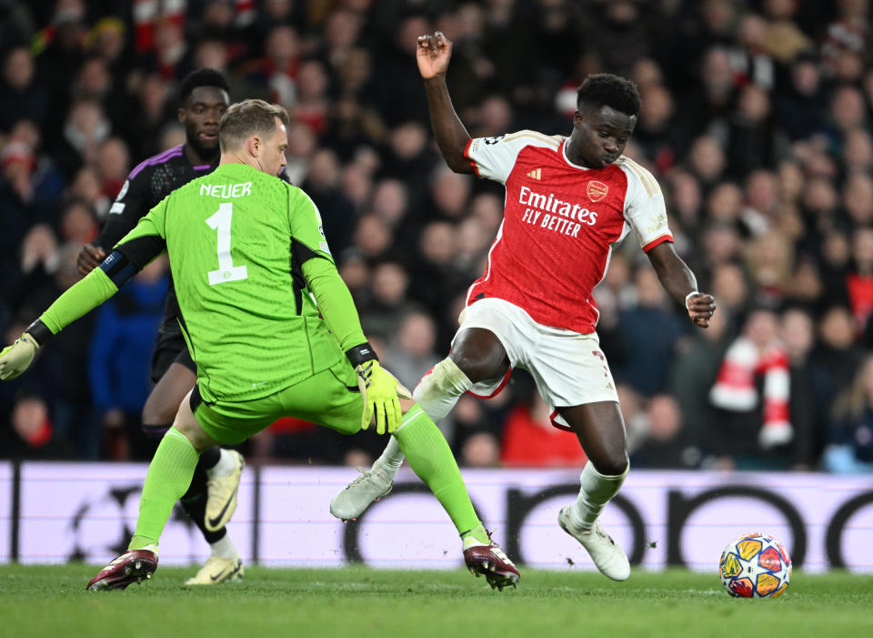 LONDON, ENGLAND - APRIL 09: Arsenal's Bukayo Saka goes down after a challenge by Bayern Munich goalkeeper Manuel Neuer during the UEFA Champions League quarter-final first leg match between Arsenal FC and FC Bayern München at Emirates Stadium on April 09, 2024 in London, England. (Photo by Stuart MacFarlane/Arsenal FC via Getty Images)