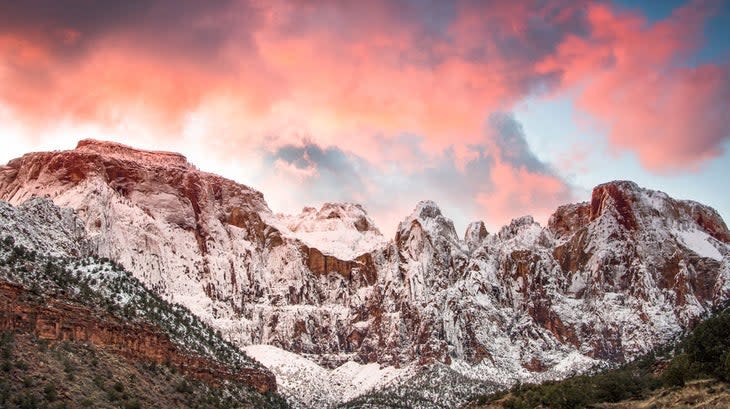 Towers of the Virgin after a dusting of snow during sunset in Zion National Park