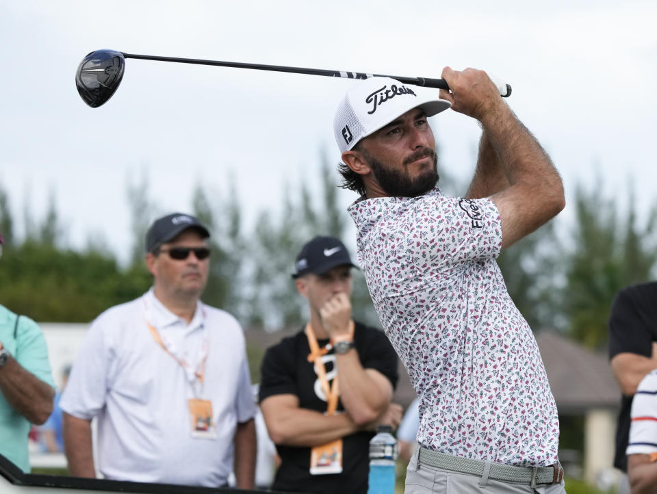 Max Homa, of the United States, watches his shot on the first tee during the first round of the Hero World Challenge PGA Tour at the Albany Golf Club, in New Providence, Bahamas, Thursday, Dec. 1, 2022. (AP Photo/Fernando Llano)