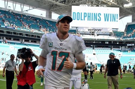 Sep 23, 2018; Miami Gardens, FL, USA; Miami Dolphins quarterback Ryan Tannehill (17) runs off the field after a game against the Oakland Raiders at Hard Rock Stadium. Mandatory Credit: Steve Mitchell-USA TODAY Sports