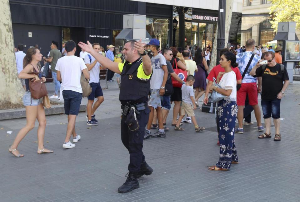 Police direct crowds on Las Ramblas (AP)