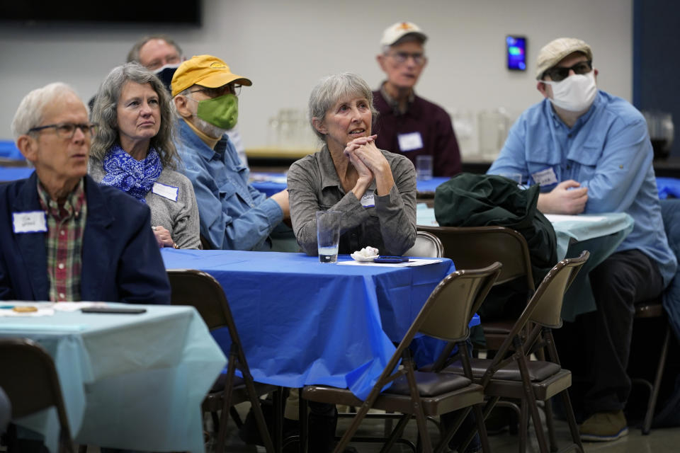 Local residents list to Iowa Democratic gubernatorial candidate Deidre DeJear speak at the Story County Democrats Super Soup Fundraiser, Saturday, March 12, 2022, in Nevada, Iowa. (AP Photo/Charlie Neibergall)