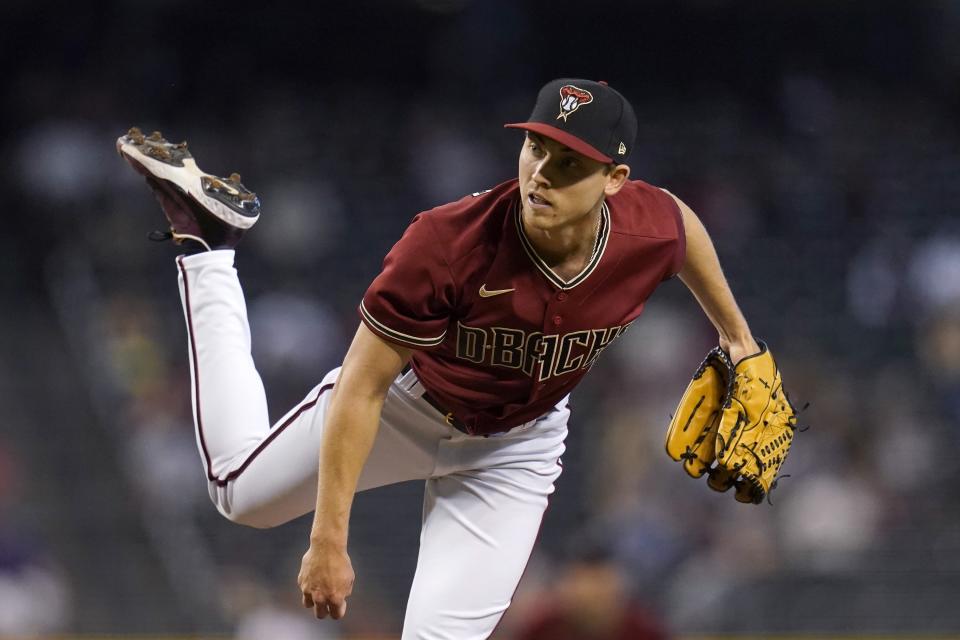 Arizona Diamondbacks starting pitcher Luke Weaver throws against the Cincinnati Reds during the first inning of a baseball game Sunday, April 11, 2021, in Phoenix. (AP Photo/Ross D. Franklin)