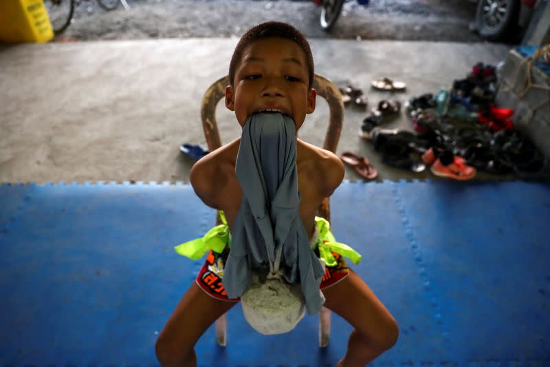 The Wider Image: Punching out of poverty: Despite risks, nine-year-old Thai fighter eager to return to ring