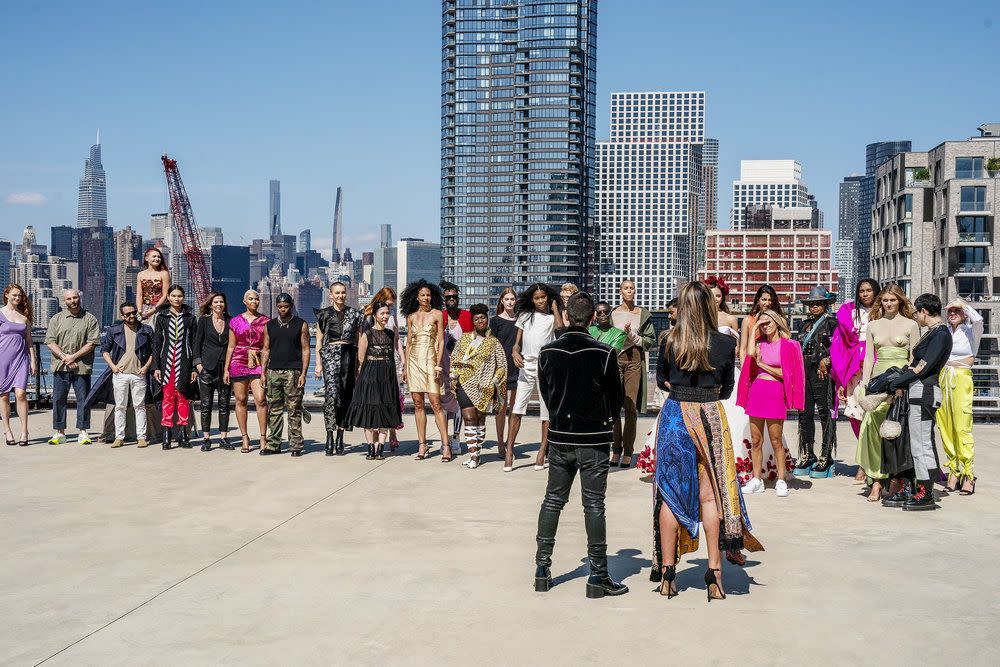 rami kashou, viktor luna, mila hermanovski, bishme cromartie, anna zhou, prajje oscar jean baptiste, korto momolu, laurence basse, fabio costa, nora pagel, kara saun, hester sunshine, and brittany allen stand outside in new york city as they hear from christian siriano and nina garcia during season 20 episode 1 of project runway