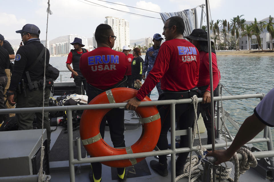 Divers from the Navy and the Urgent Medical Rescue Squadron (ERUM) search for bodies weeks after the passing of Hurricane Otis, in Acapulco, Mexico, Saturday, Nov. 11, 2023. It was 12:20 a.m. on Oct. 25. when Hurricane Otis made landfall in this Pacific port city as a Category 5 hurricane, leaving 48 dead, mostly by drowning, and 31 missing, according to official figures. Sailors, fishermen and relatives of crew members believe that there may be more missing because sailors often go to take care of their yachts when a storm approaches. (AP Photo/Marco Ugarte)