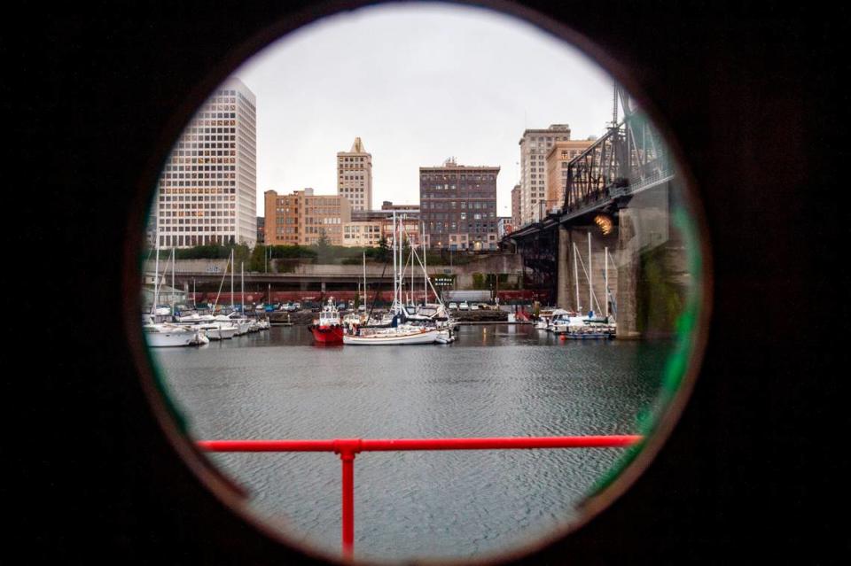 A partial view of Murray Morgan Bridge and downtown Tacoma is seen through a porthole on the third deck of the Annabelle on