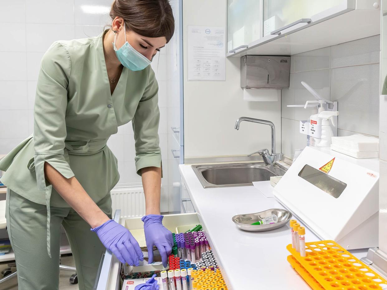 A nurse takes blood specimen at IVMED