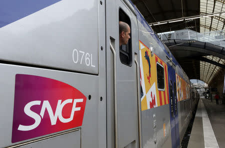 A conductor is seen aboard a TGV high-speed train at the Nice railway station on the second day of a nationwide strike by French SNCF railway workers in Nice, France, April 4, 2018. REUTERS/Eric Gaillard