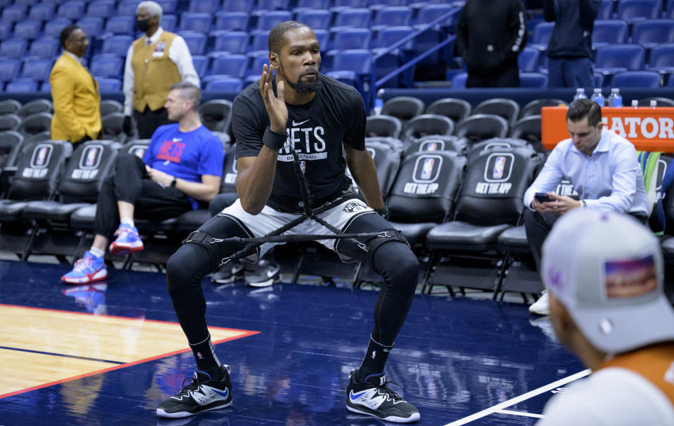 Brooklyn Nets forward Kevin Durant warms up before an NBA basketball game against the New Orleans Pelicans in New Orleans, Friday, Jan. 6, 2023. (AP Photo/Matthew Hinton)