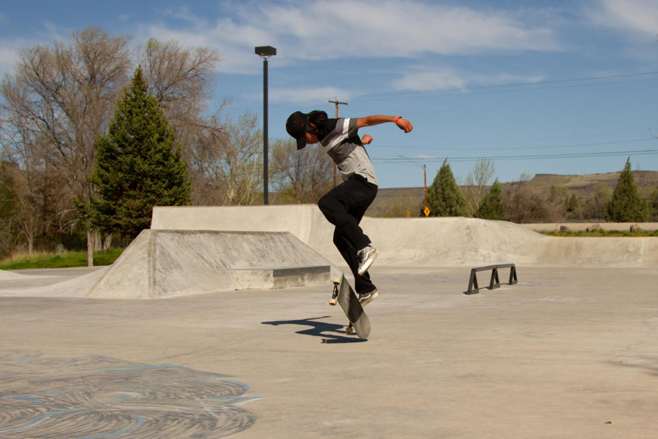 Erick Williams, a 16 year-old junior at Warm Springs High School, does a nollie kickflip during an afternoon skating session with his crew on April 30, 2023. Photo by Jarrette Werk (Underscore News/Report for America)