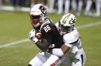 North Carolina State wide receiver Emeka Emezie (86) pulls in a reception as Georgia Tech defensive back Wesley Walker (39) defends during the second half of an NCAA college football game in Raleigh, N.C., Saturday, Dec. 5, 2020. (Ethan Hyman/The News & Observer via AP, Pool)