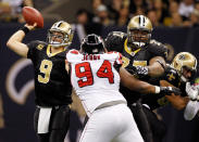 NEW ORLEANS, LA - DECEMBER 26: Quarterback Drew Brees #9 of the New Orleans Saints passes the ball as he uses a block from offensive guard Carl Nicks #77 against defensive tackle Peria Jerry #94 of the Atlanta Falcons at the Mercedes-Benz Superdome on December 26, 2011 in New Orleans, Louisiana. (Photo by Chris Graythen/Getty Images)