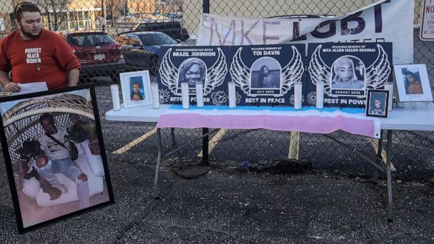 PHOTO: Jaxon Seeger displays photos of transgender women and LGBT individuals who have died by homicide, during the vigil for Cashay Henderson, on March 1, 2023. (Ebony Cox/Milwaukee Journal Sentinel via USA Today Network)