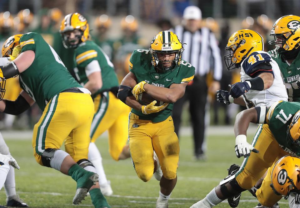 St. Edward running back Marvin Bell carries up the middle in the second half against Springfield during the Division I state championship game at Tom Benson Hall of Fame Stadium in Canton, Friday, Dec. 2, 2022.