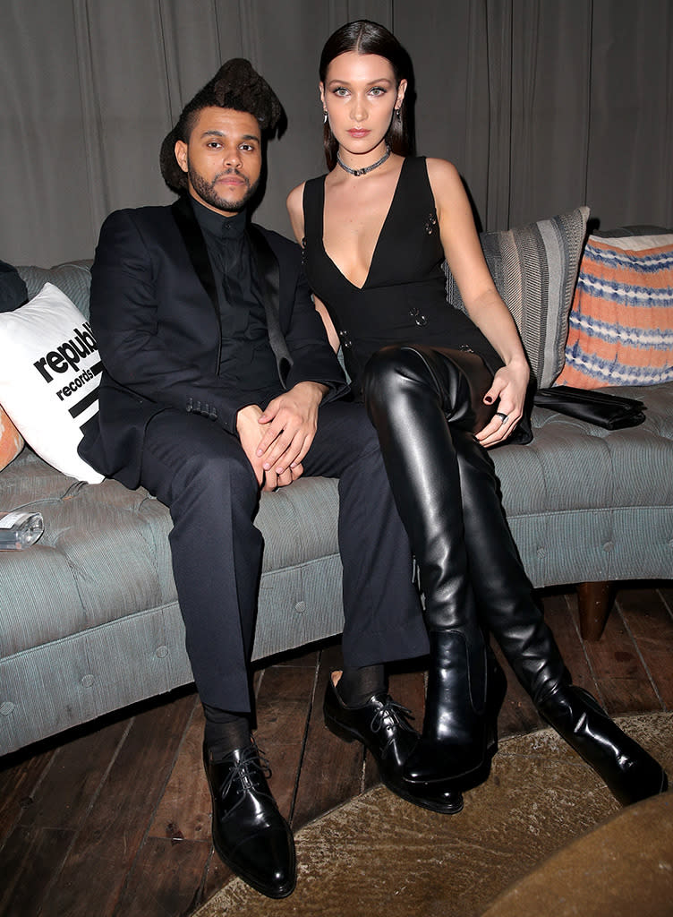 The Weeknd and his girlfriend of nearly one year, model Bella Hadid, made their sizzling red carpet debut as a couple earlier in the evening, and looked no less smokin’ — Bella’s boots up to there and all — at the Republic Records Grammy party at Hyde Sunset Kitchen + Cocktails. (Imeh Akpanudosen/Getty Images)