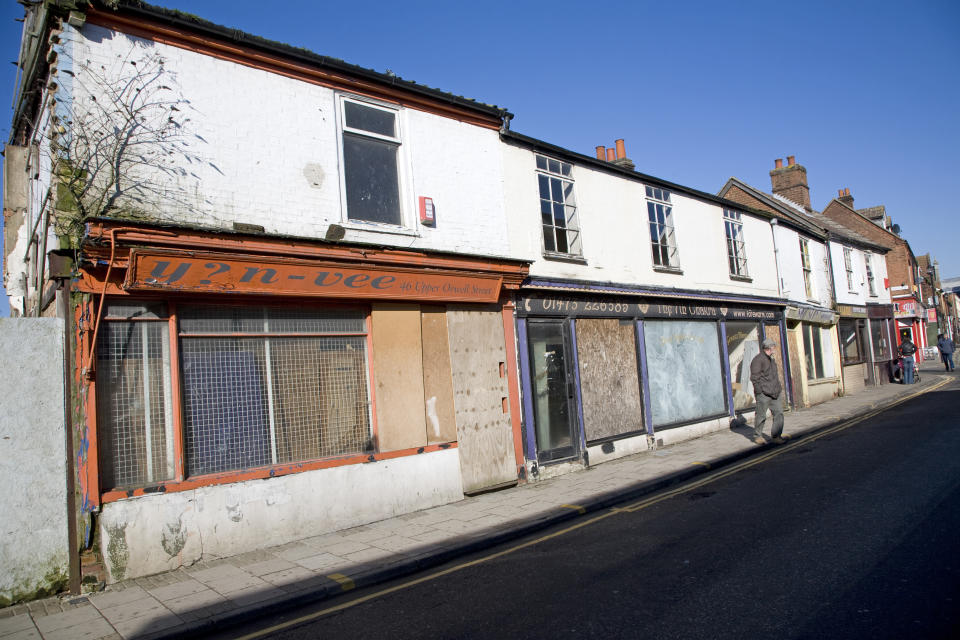 Boarded up shops are a feature of many of Britain’s high streets (Geography Photos/UIG via Getty Images)