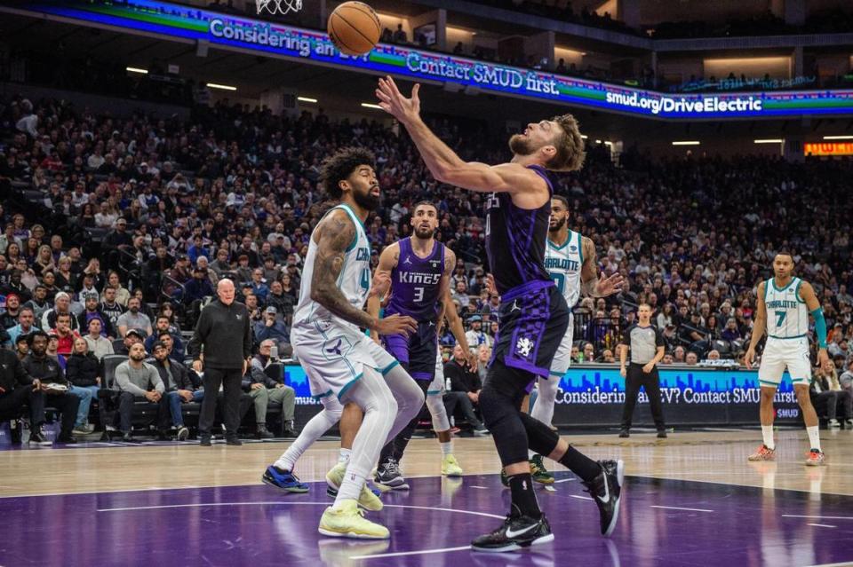 Sacramento Kings center Domantas Sabonis (10) has one of his 11 turnovers in front of Charlotte Hornets center Nick Richards (4) during the first half of an NBA game on Tuesday, Jan., 2, 2024, at Golden 1 Center in Sacramento.