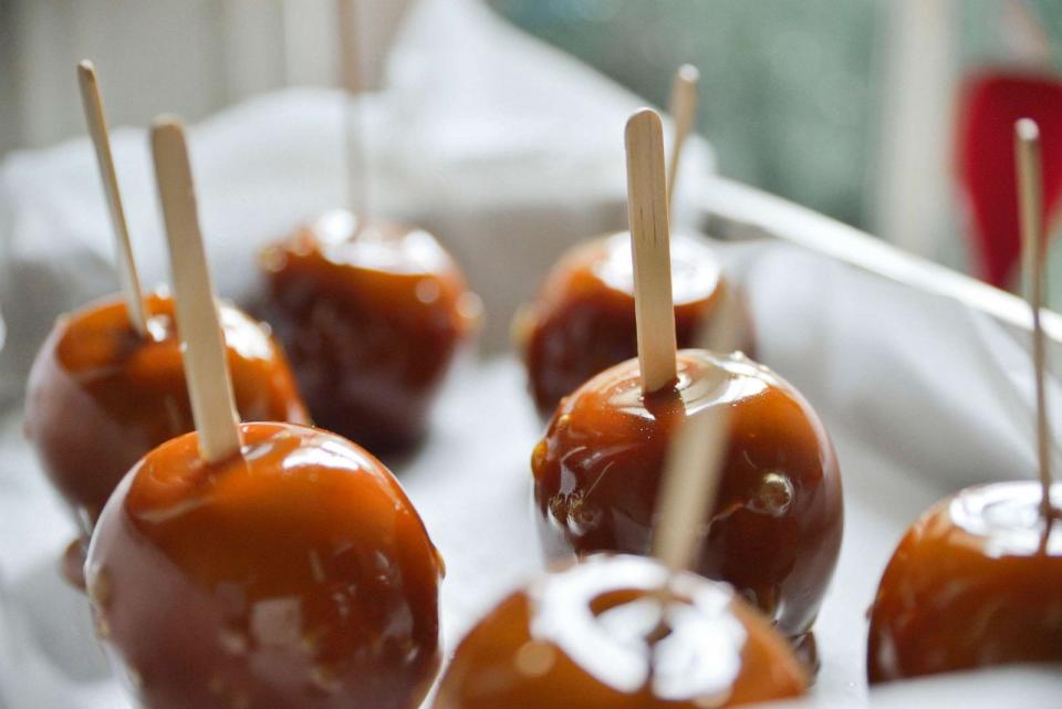 PHOTO: Caramel apples cool on wax paper. (Neville Mountford-Hoar/PhotoAlto via Getty Images, FILE)