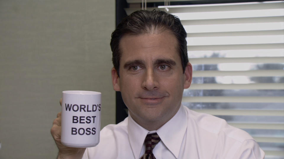 michael holding his world's best boss mug on the office