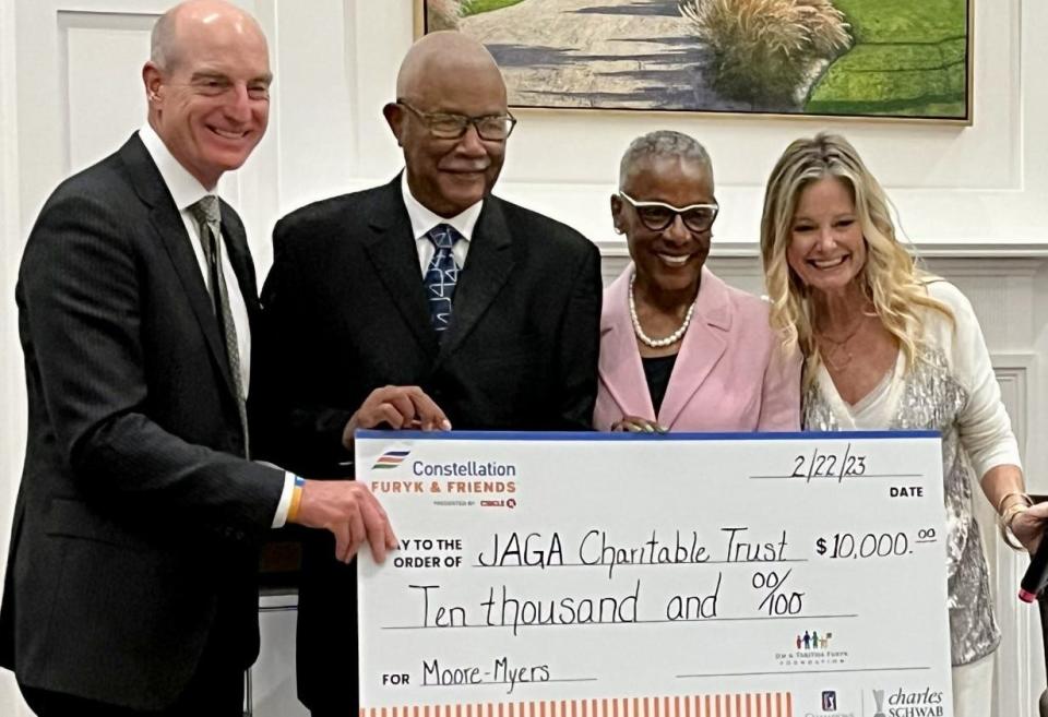 Jim Furyk (far left) and his wife Tabitha Furyk (far left) presented a check for $10,000 to Richard Blackston and Justine Redding of the Moore-Myers Children's Fund during the First Coast Celebration of Golf banquet on Feb. 22 at the Sawgrass Country Club.