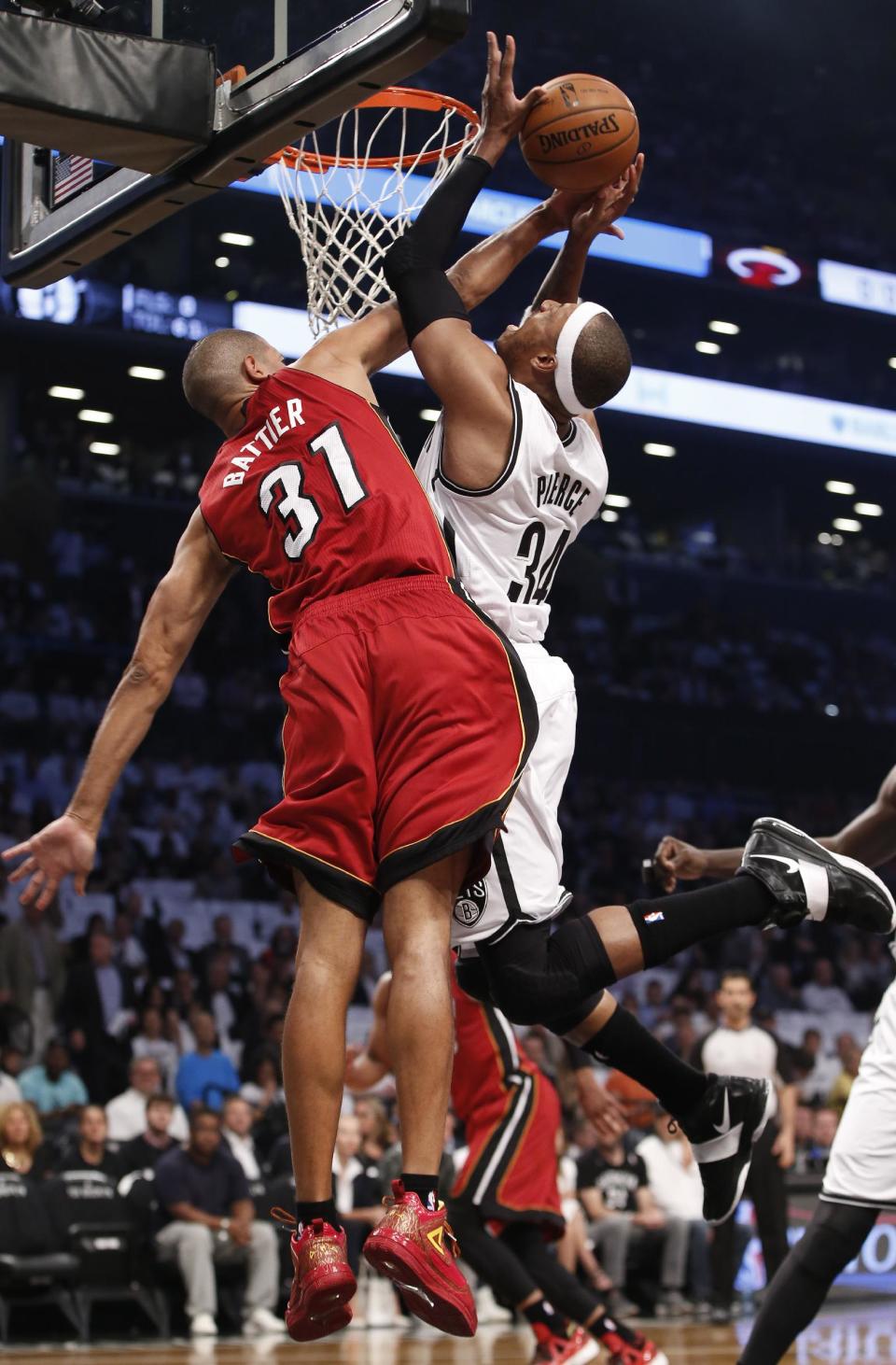 Miami Heat forward Shane Battier (31) defends Brooklyn Nets forward Paul Pierce (34) in the first half of Game 4 of a second-round NBA playoff basketball game at the Barclays Center, Monday, May 12, 2014, in New York. (AP Photo)