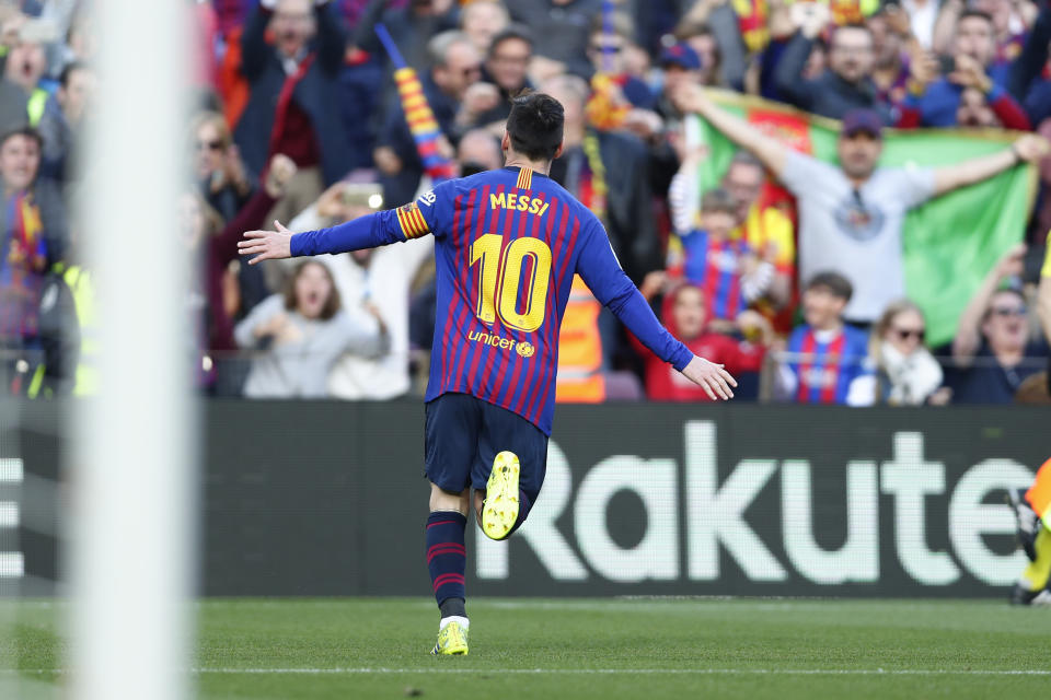 Barcelona's Lionel Messi celebrates after scoring the opening goal during a Spanish La Liga soccer match between FC Barcelona and Espanyol at the Camp Nou stadium in Barcelona, Spain, Saturday March 30, 2019. (AP Photo/Manu Fernandez)