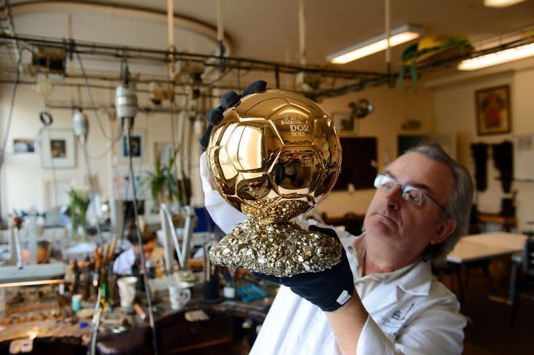 French artisan Michel Garault works on the FIFA Ballon d'Or 2012 ('Golden Ball'), at the Mellerio jewelery workshops in Paris, on December 6, 2012. The displays at Mellerio jewellers in Paris teem with diamonds and sapphires. But to football fans they pale in comparison with the golden orb on a bed of pyrite crafted by the house for the FIFA Ballon d'Or