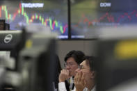 Currency traders watch monitors at the foreign exchange dealing room of the KEB Hana Bank headquarters in Seoul, South Korea, Tuesday, Sept. 17, 2019. Shares were mostly lower in Asia on Tuesday after an attack on Saudi Arabia’s biggest oil processing plant caused crude prices to soar, prompting selling of airlines and other fuel-dependent industries. (AP Photo/Ahn Young-joon)