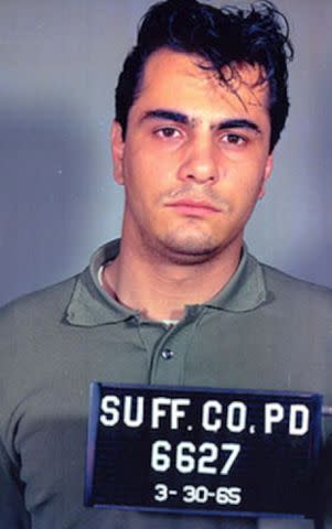 <p>Kypros/Getty</p> John Gotti in a mug shot on March 30, 1965.