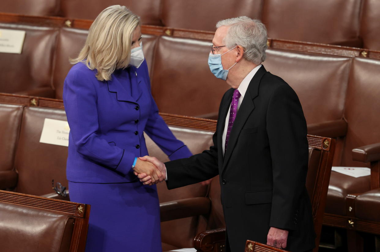 U.S. House Republican Conference Chairperson Rep. Liz Cheney (R-WY) shakes hands with Senate Minority Leader Mitch McConnell (R-KY) on the floor of the U.S. House Chamber as they await the start of President Joe Biden's first address to a joint session of the U.S. Congress at the U.S. Capitol in Washington, U.S., April 28, 2021. REUTERS/Jonathan Ernst/Pool