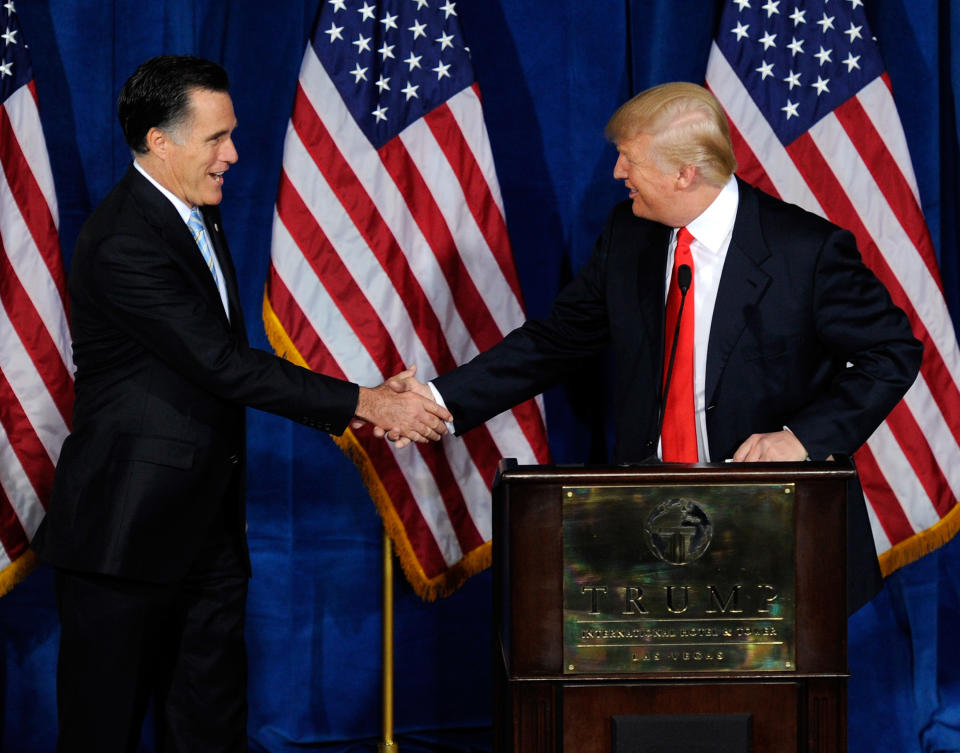 Republican presidential candidate, former Massachusetts Gov. Mitt Romney (L) and Donald Trump shake hands during a news conference held by Trump to endorse Romney for president at the Trump International Hotel & Tower Las Vegas February 2, 2012 in Las Vegas, Nevada.