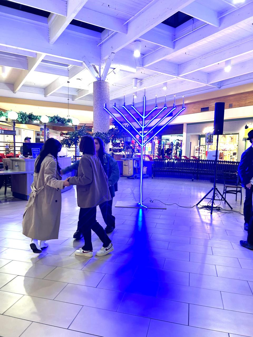 Members of the public stopped the enjoy the festival honoring the sixth day of Hanukkah held at Westgate Mall Tuesday night.