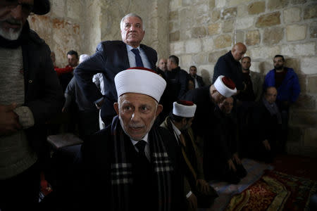 Chairman of the Waqf Council, Abdel-Azeem Salhab, attends Friday prayers together with other Palestinian Muslims inside the Golden Gate near Al-Aqsa Mosque in Jerusalem's Old City February 22, 2019. REUTERS/Ammar Awad