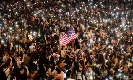 Anti-government demonstrators march in protest against the invocation of the emergency laws in Hong Kong