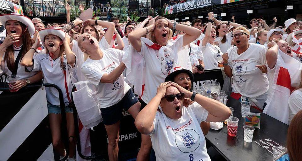 Fans react during the Women's World Cup final match
