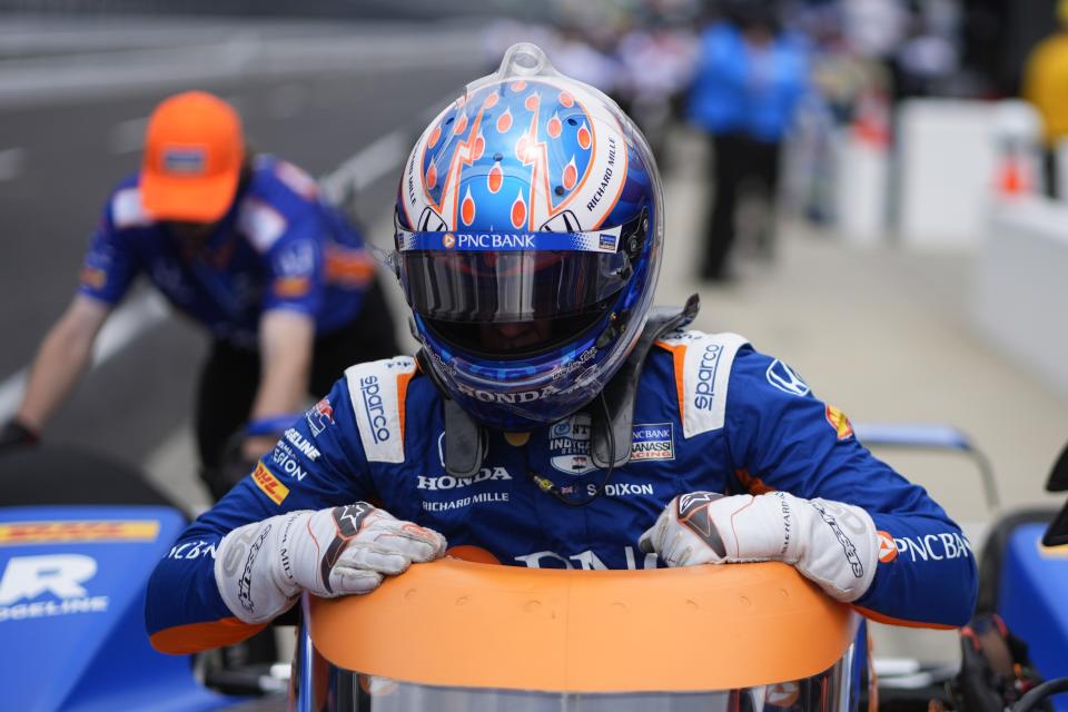 Scott Dixon, of New Zealand, climbs out of his car during a practice session for the Indianapolis 500 auto race at Indianapolis Motor Speedway, Friday, May 17, 2024, in Indianapolis. (AP Photo/Darron Cummings)