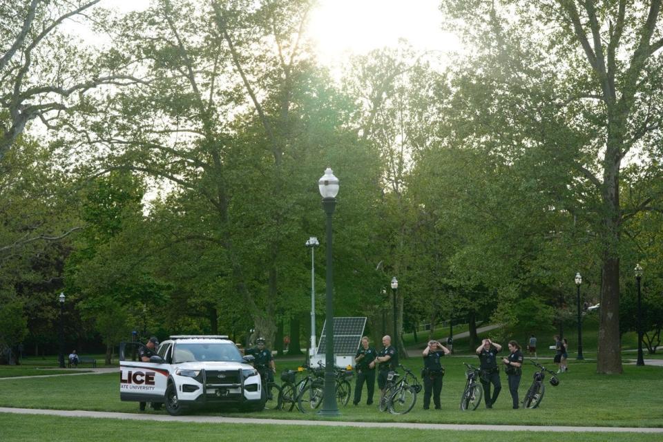 Ohio State University police assembled on the South Oval with police cruisers and bicycles. OSU police are joined by Ohio State Highway Patrol troopers again Wednesday as several hundred protesters have gathered to demonstrate.
