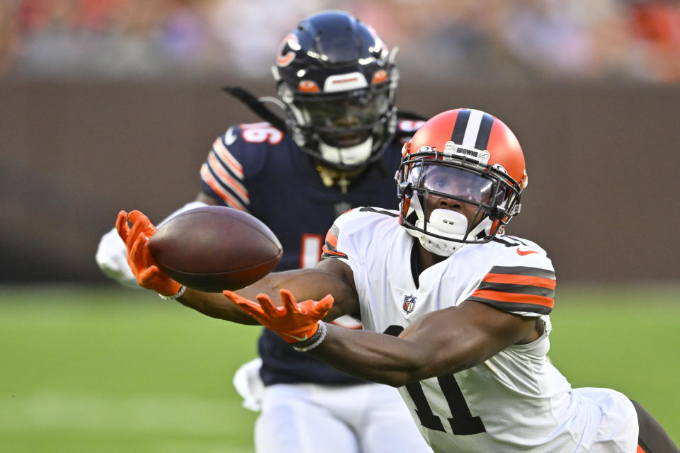 Cleveland Browns wide receiver Donovan Peoples-Jones (11) makes a catch in front of Chicago Bears cornerback Davontae Harris (16) during the first half of an NFL preseason football game, Saturday, Aug. 27, 2022, in Cleveland. (AP Photo/David Richard)